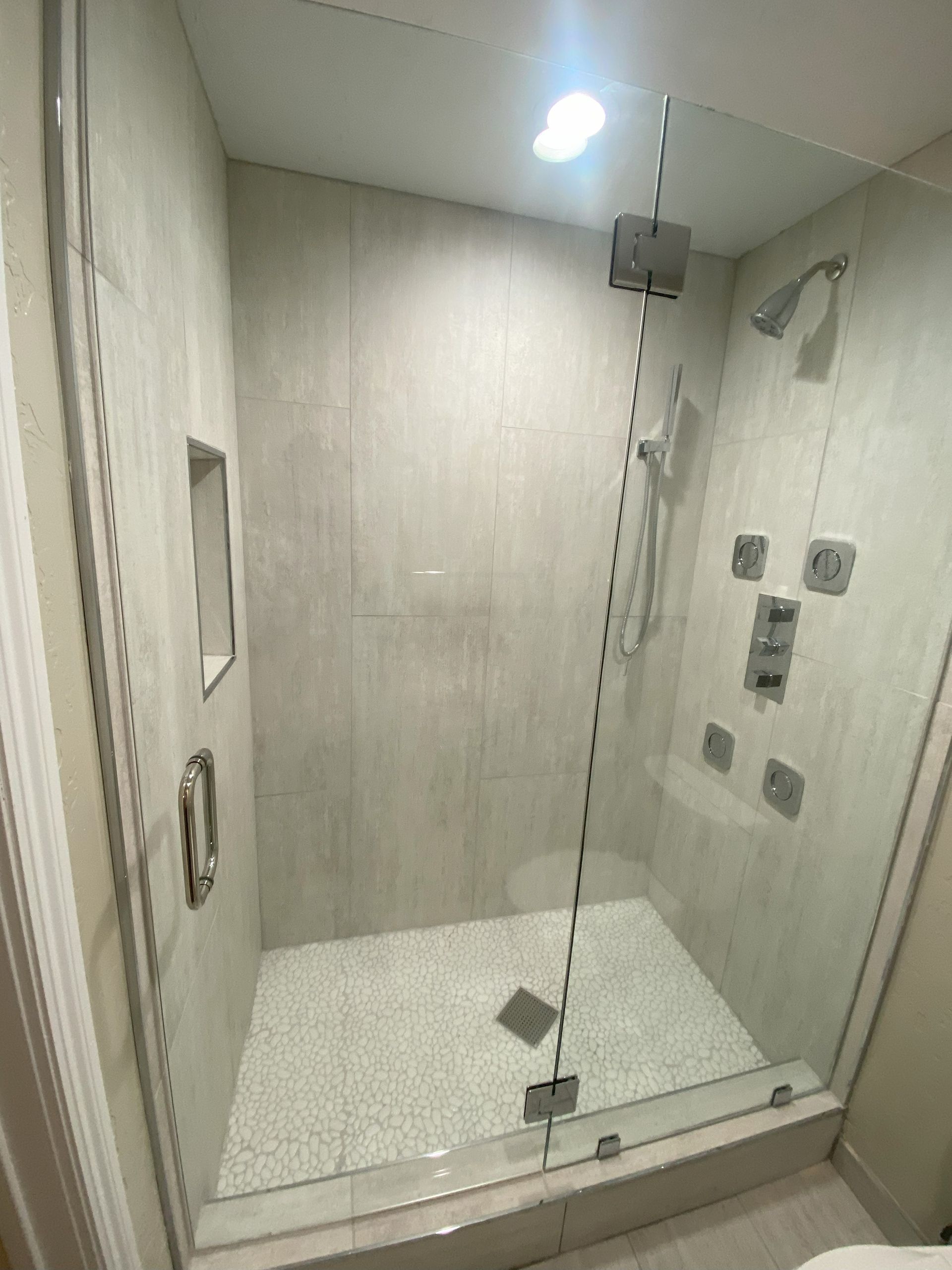 Premium tempered glass enclosure by Glassology with refined edge work and tight tolerances
