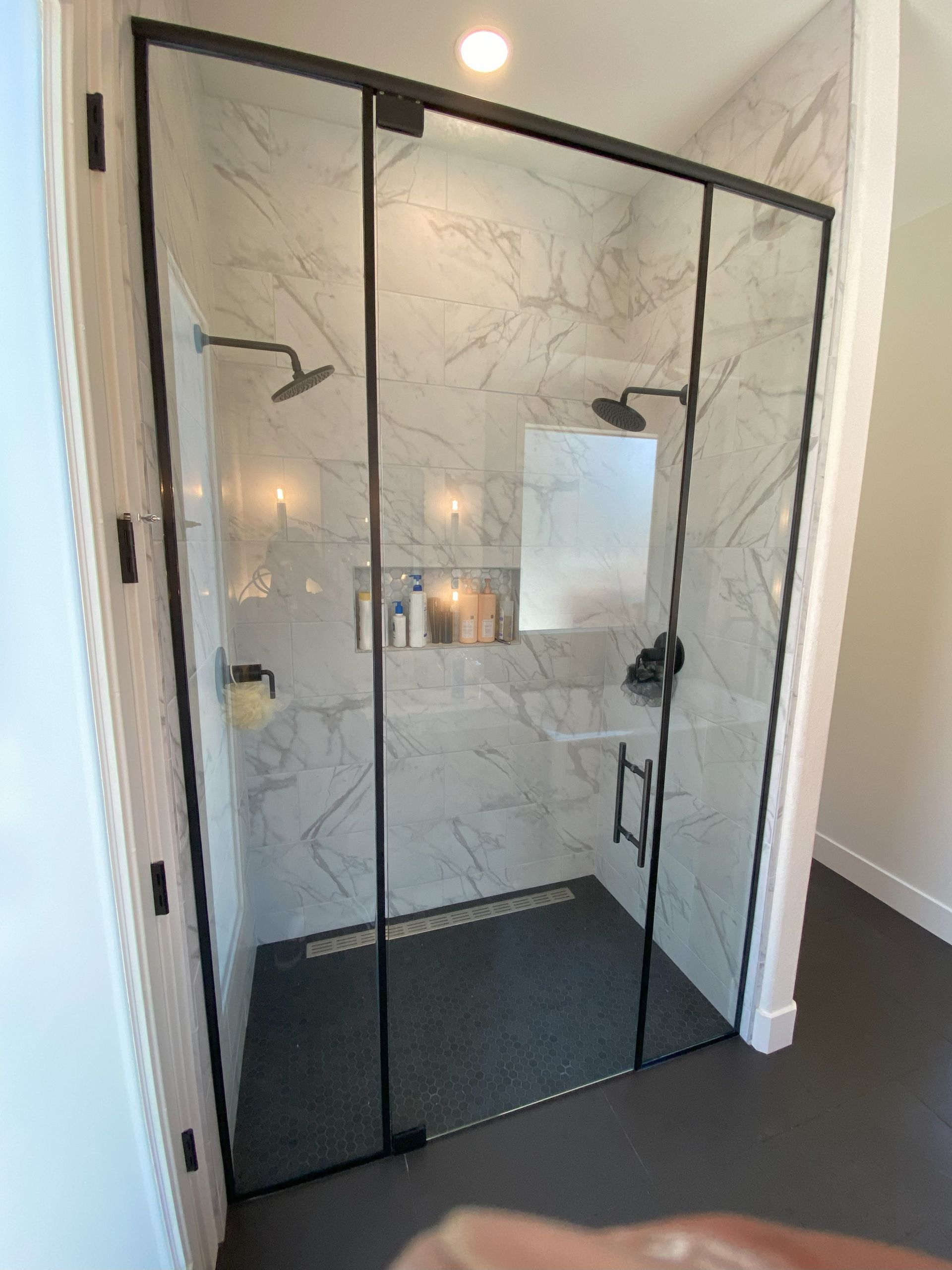 High-end bathroom remodel featuring frameless shower glass