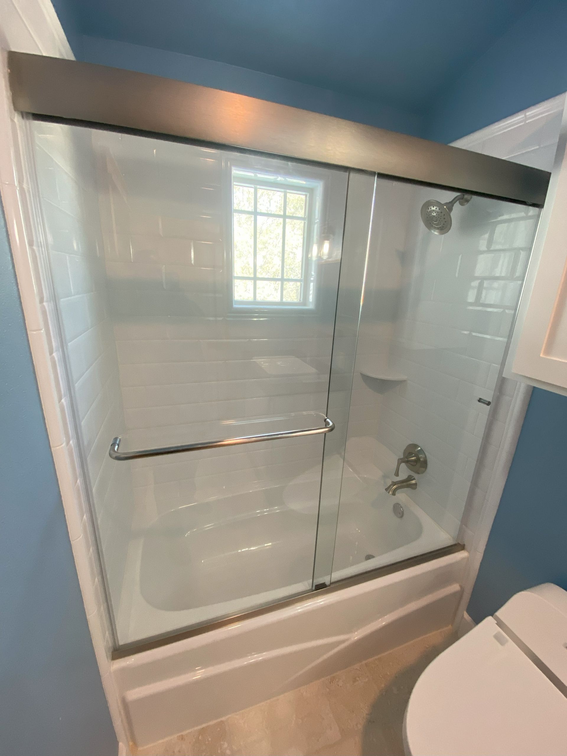 High-end bathroom remodel featuring frameless shower glass