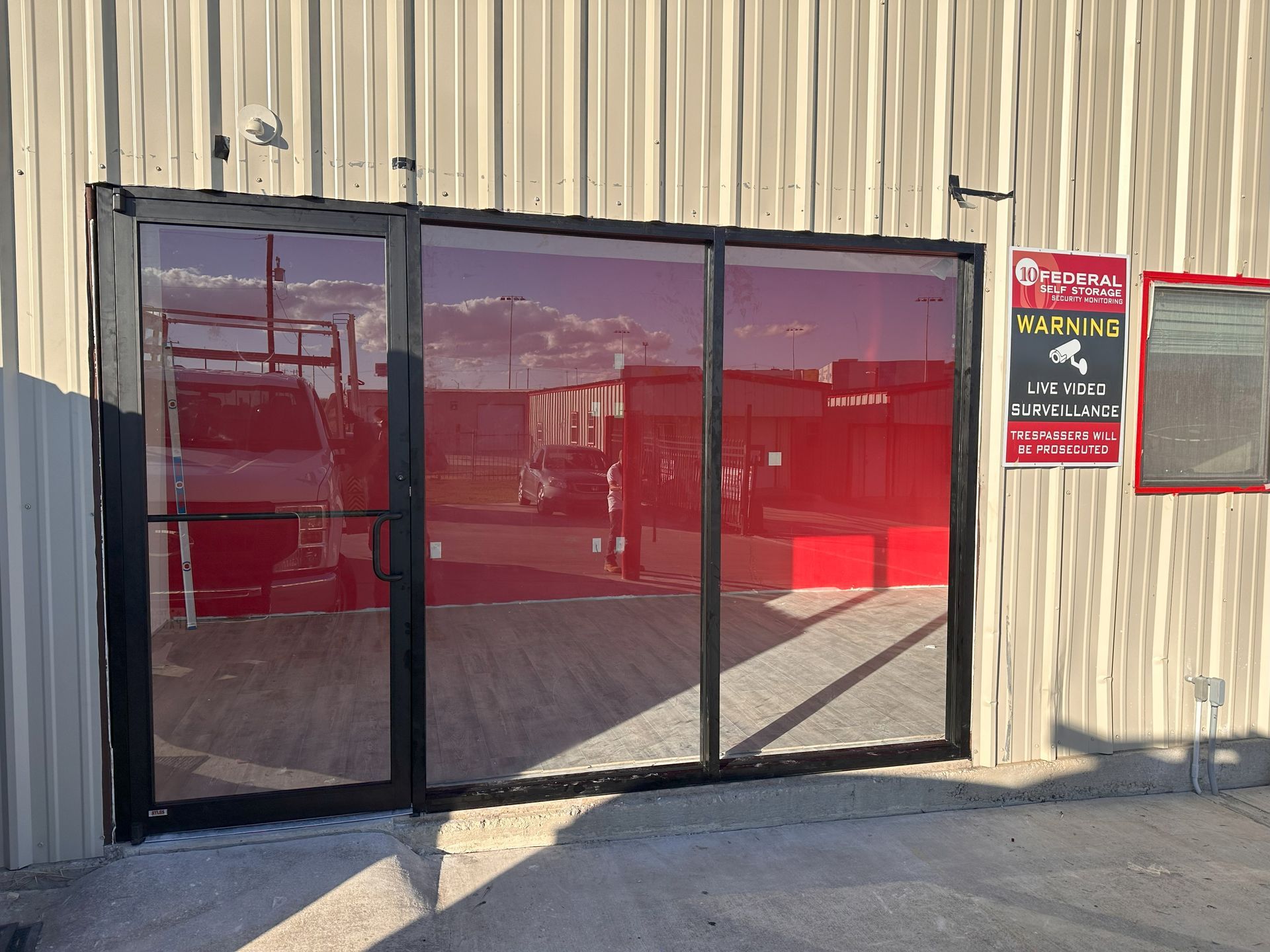 Retail storefront with new glass entry doors