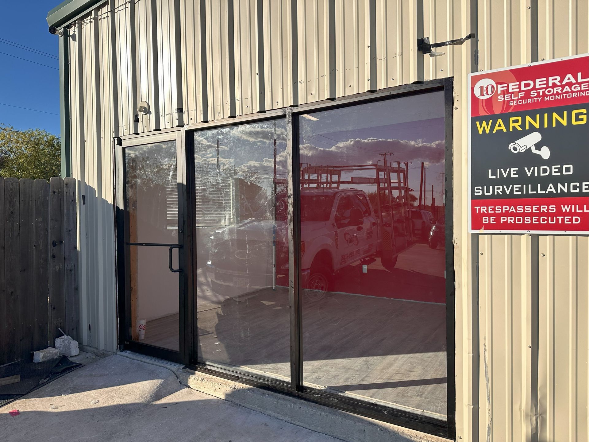 Retail storefront with new glass entry doors