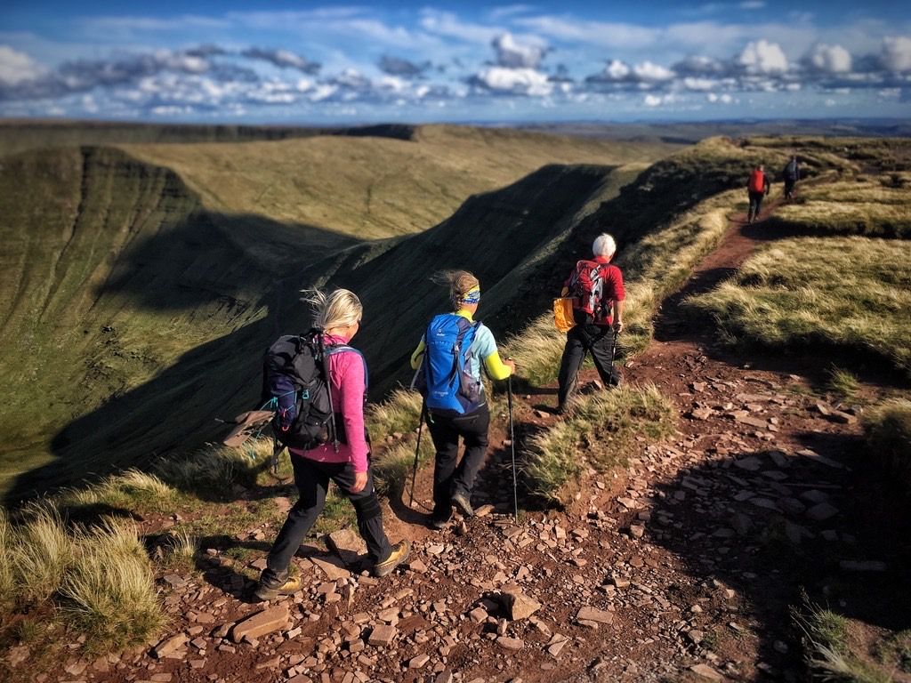 Runners on top of mountain