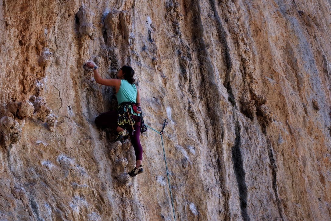 Female climber with chalked holds