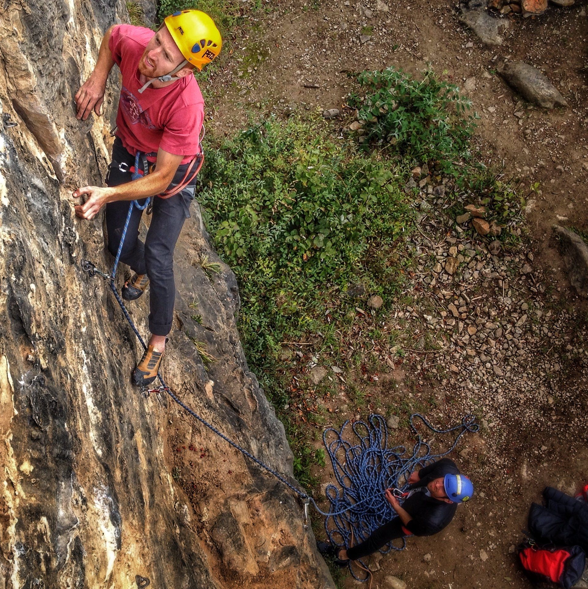 Climber making moves on a rock face