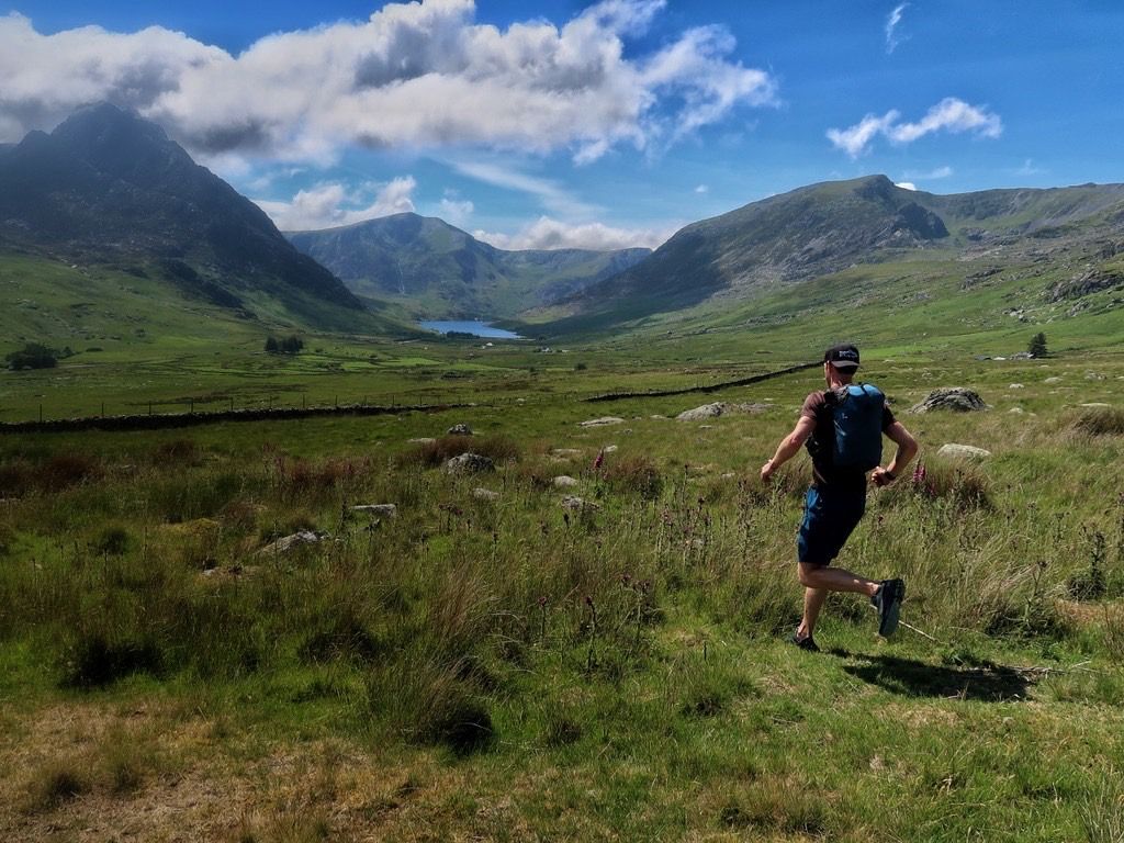 Runner running down mountainside