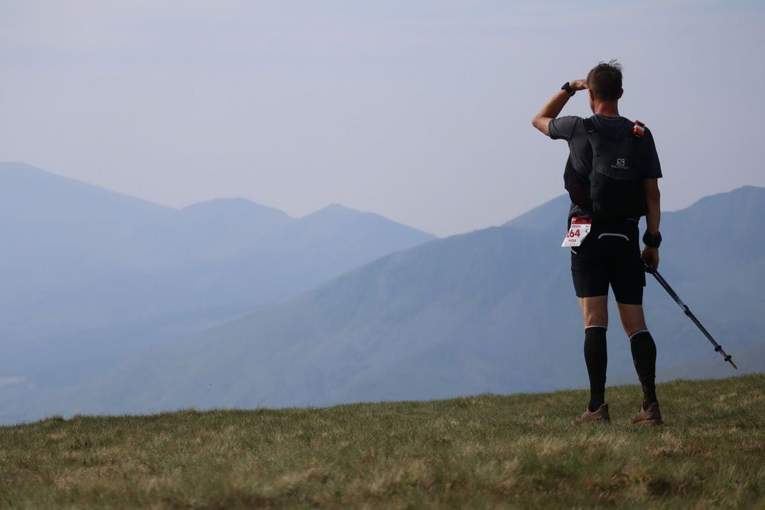 Runner looking out over mountains
