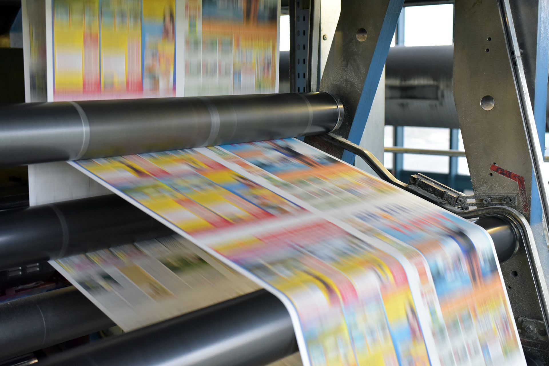 Custom Promotional Product printing in progress on a commercial offset press.