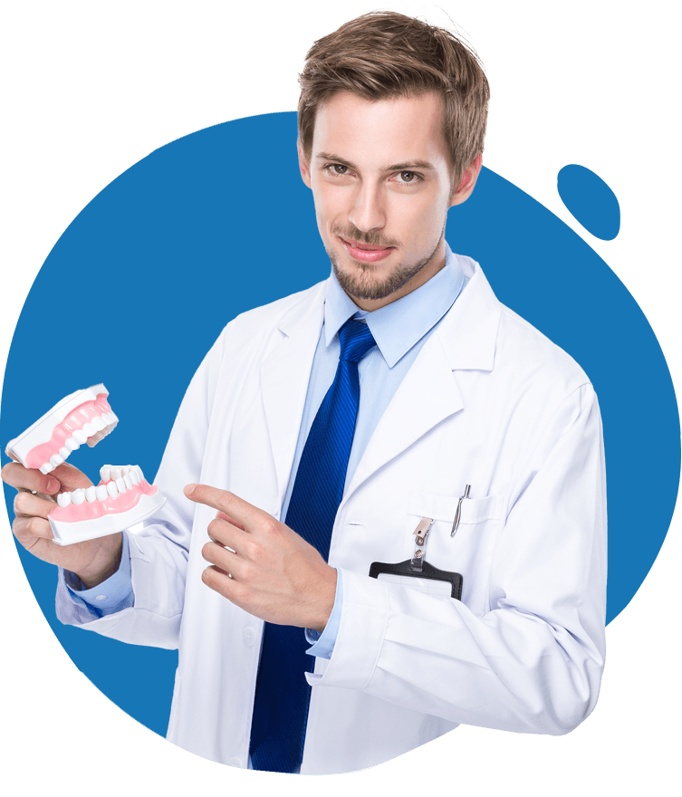Dentist Holding Dentures — Bunbury WA — FADC Dental Group