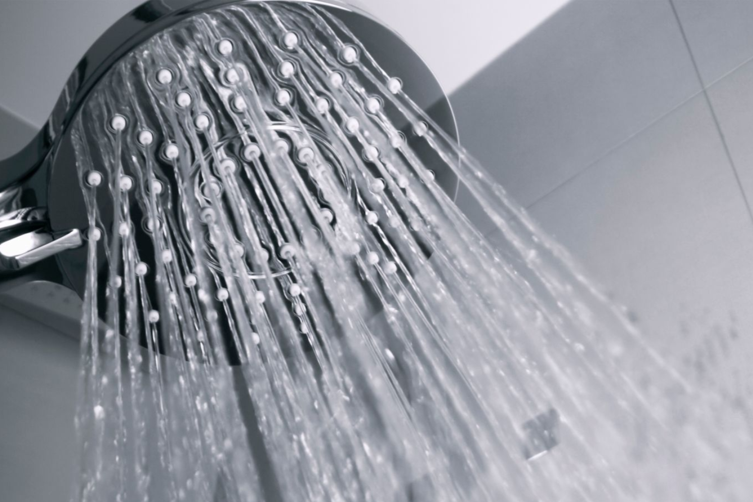 Hot water system providing consistent shower water