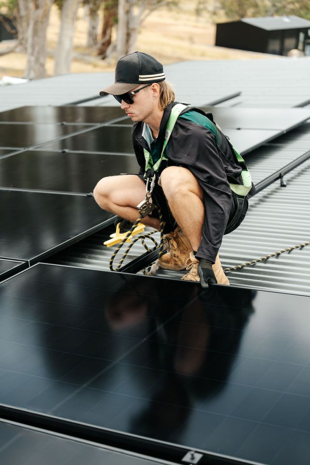 Econ Energy crew doing a maintenance on rooftop solar panels