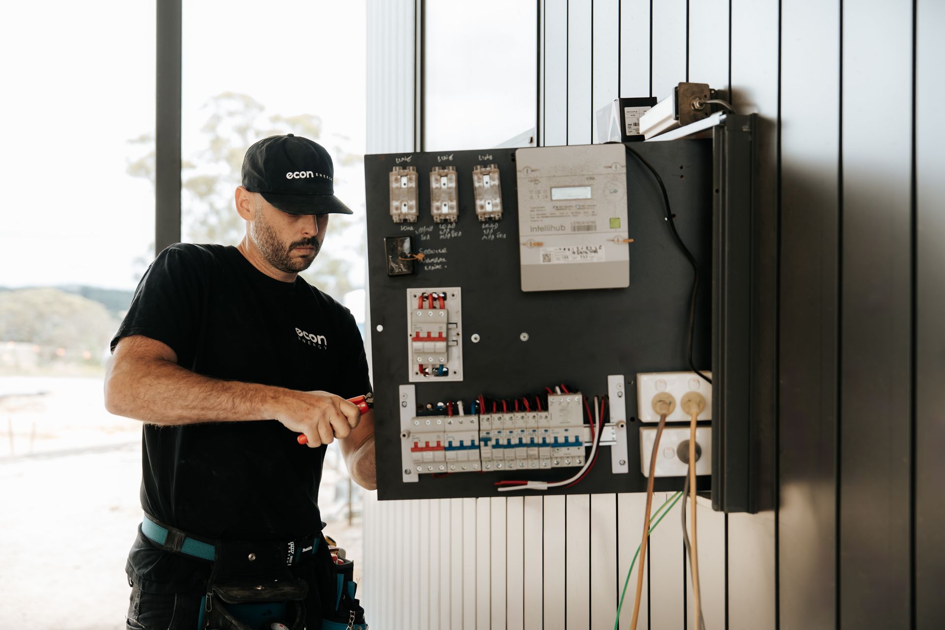 Licensed electrician carrying out electrical maintenance in Canberra
