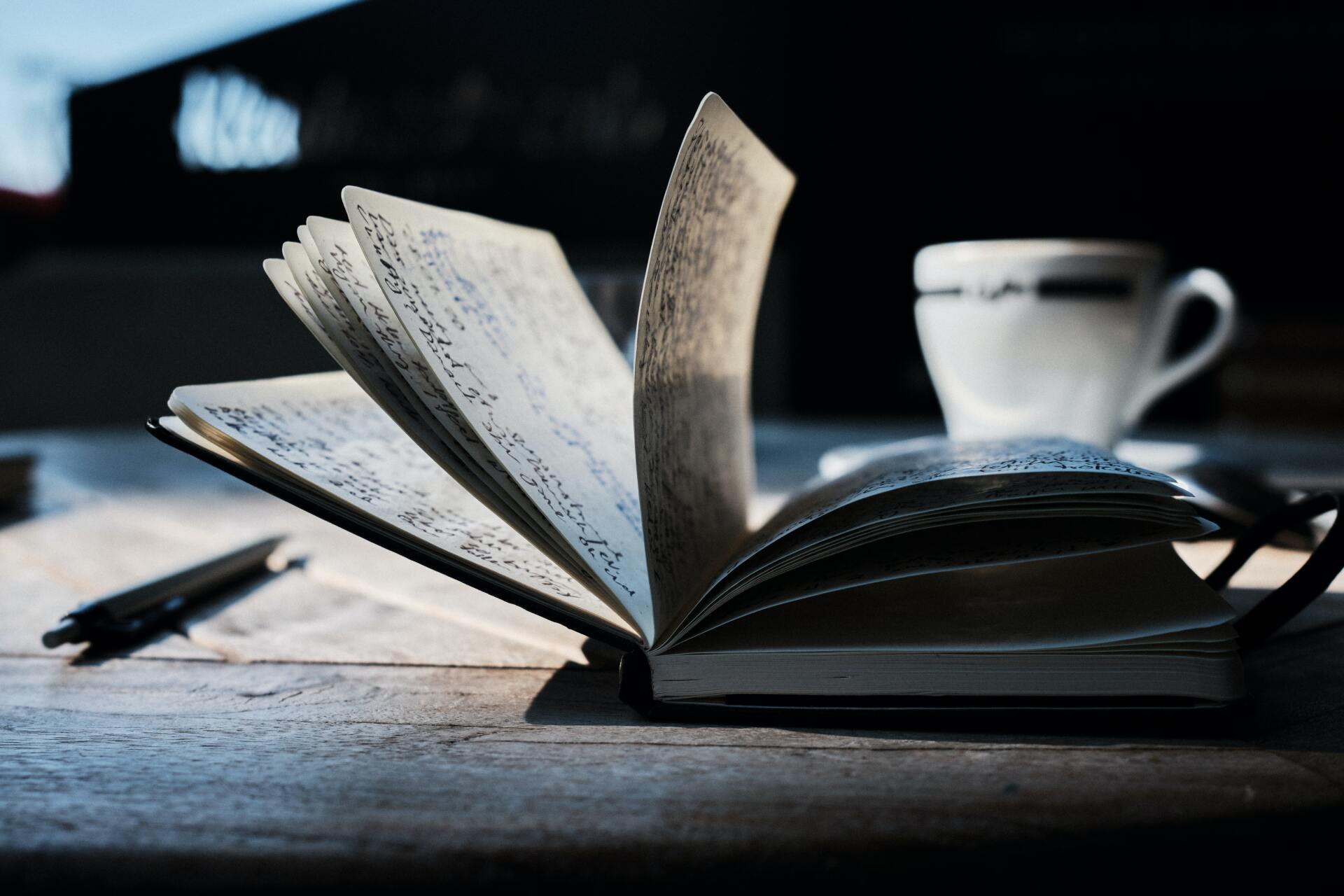 Open Notebook on Bench with Coffee Mug — Book Editor in Australia