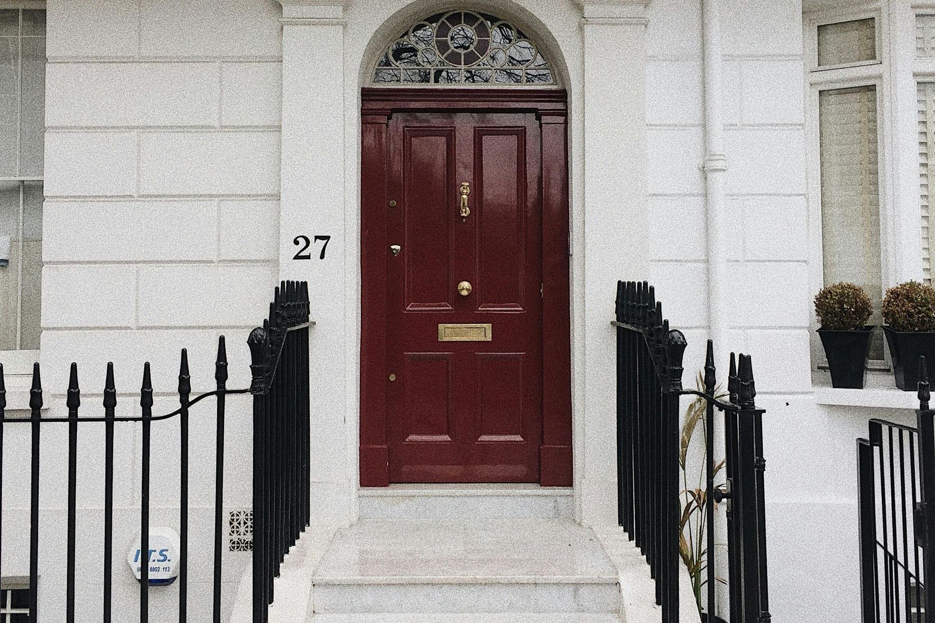 A red door with the number 27 on it
