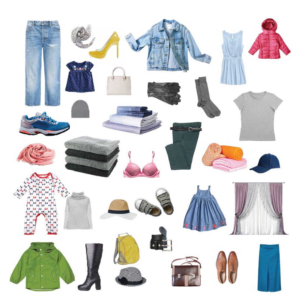Assorted clothing and accessories arranged in a flat lay, including jeans, shoes, tops, coats, bags, and dresses