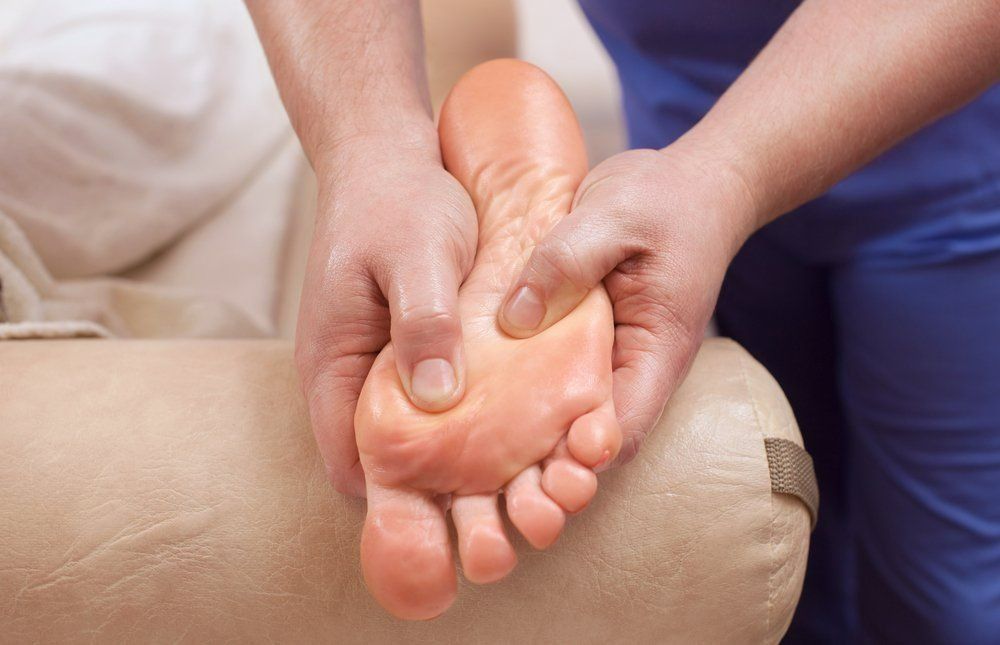 A Person is Getting a Foot Massage From a Massage Therapist — Nancy's Traditional Thai Massage In Buderim, QLD