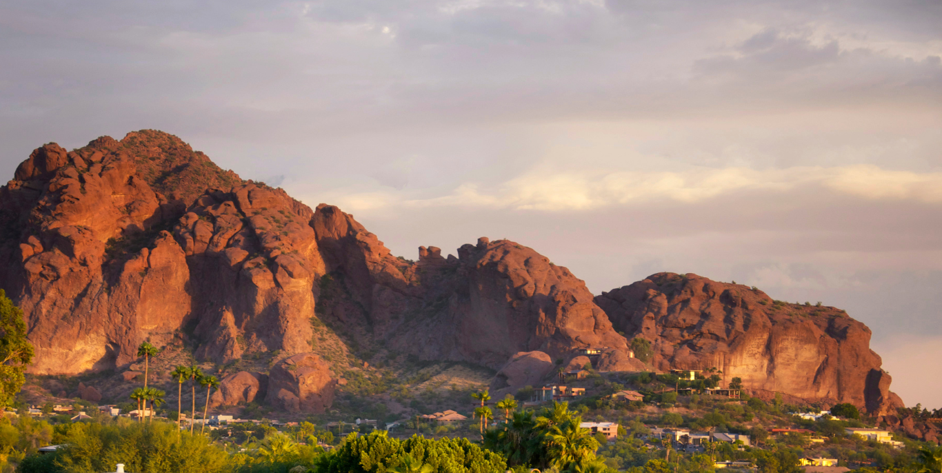 A mountain range with a city in the foreground