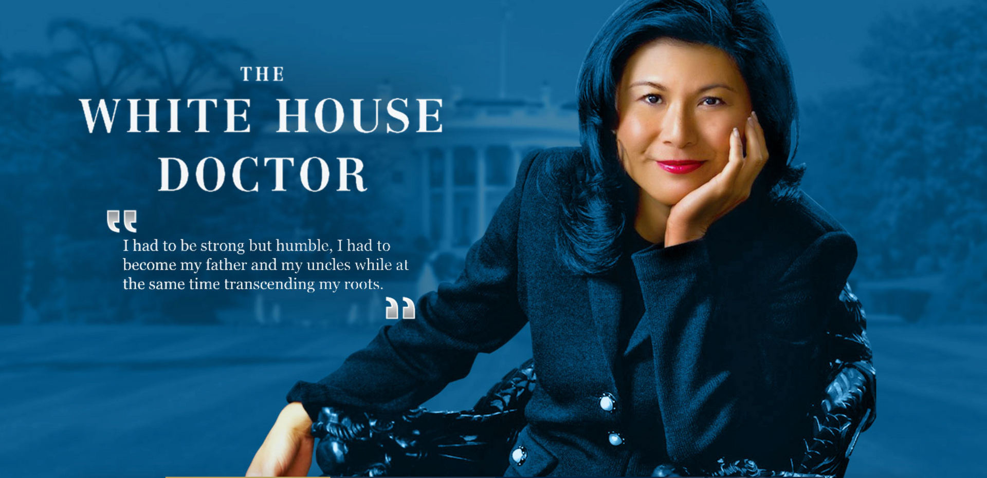 A woman sitting in front of a white house with the words
