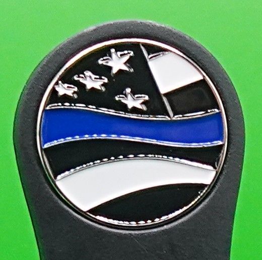 Thin blue line flag emblem on a black background, with stars and stripes.