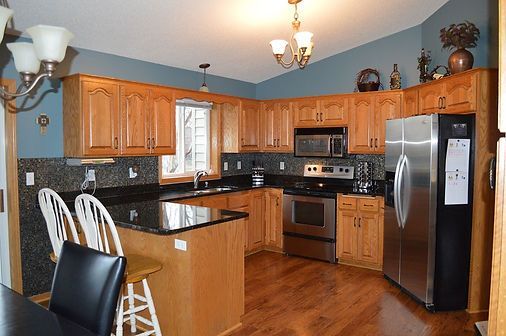 Wooden Kitchen Cabinets — St Cloud, MN — Fine Line Paint LLC