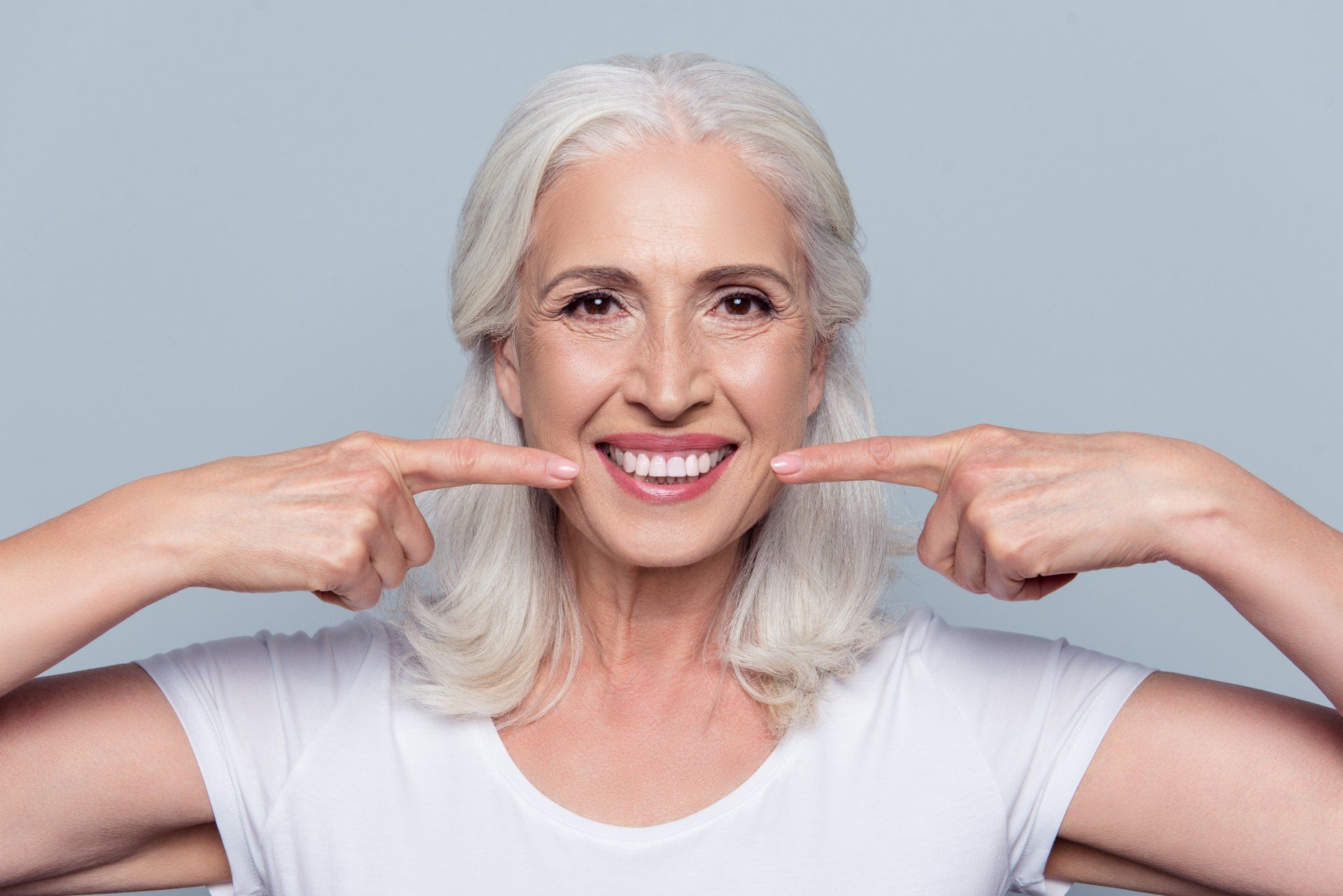 Two Personnel Doing Procedure On A Patient — Nashville, TN — Scott Nickels, DDS