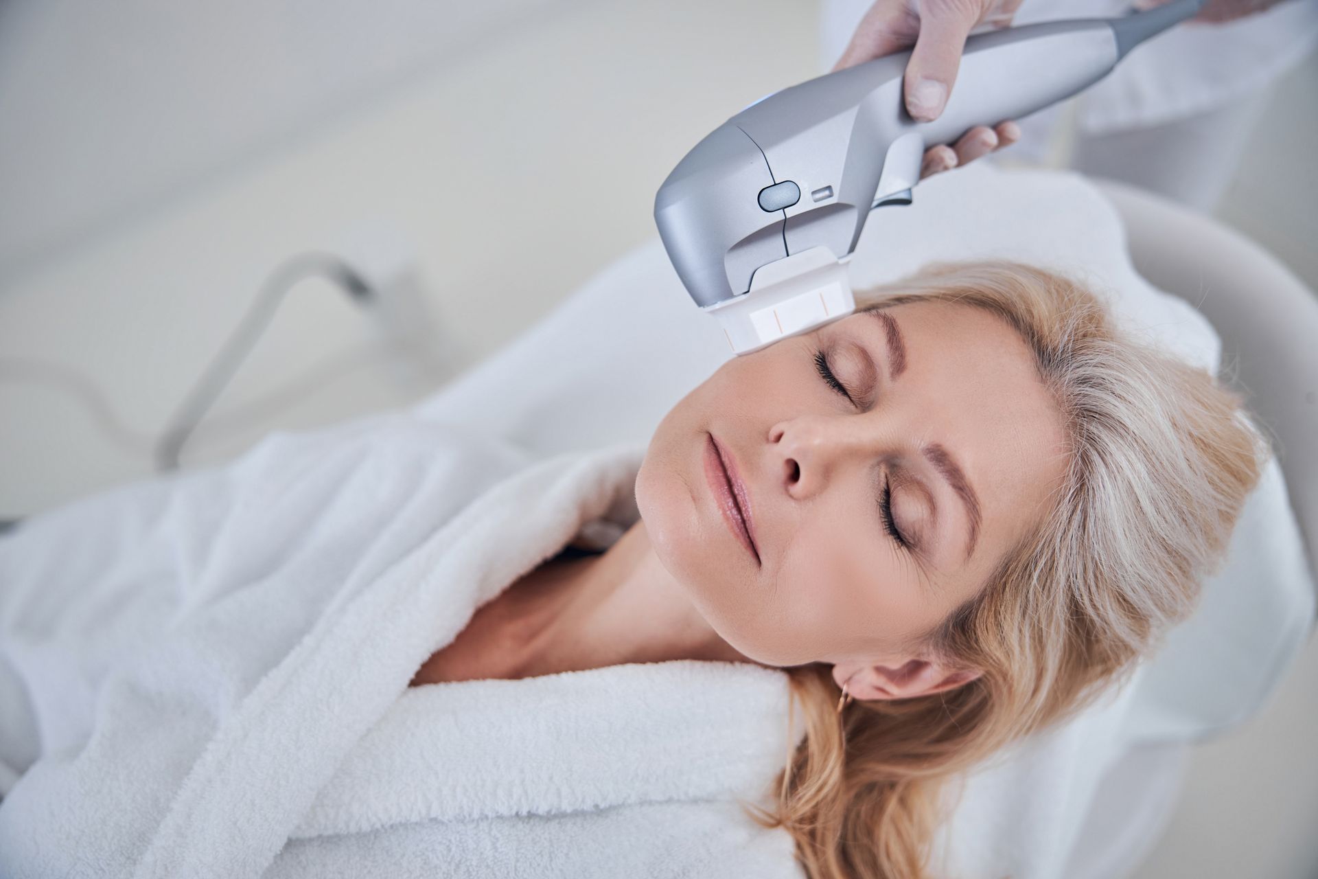 a woman is getting a hifu treatment on her face