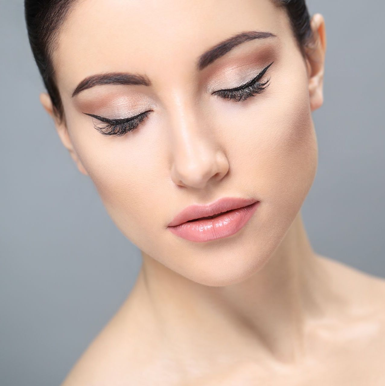 a close up of a woman 's face with her eyes closed