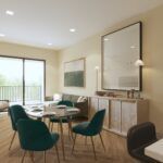 A bright dining room with four teal chairs around a circular table, near a large window, a wall console, and wall art.