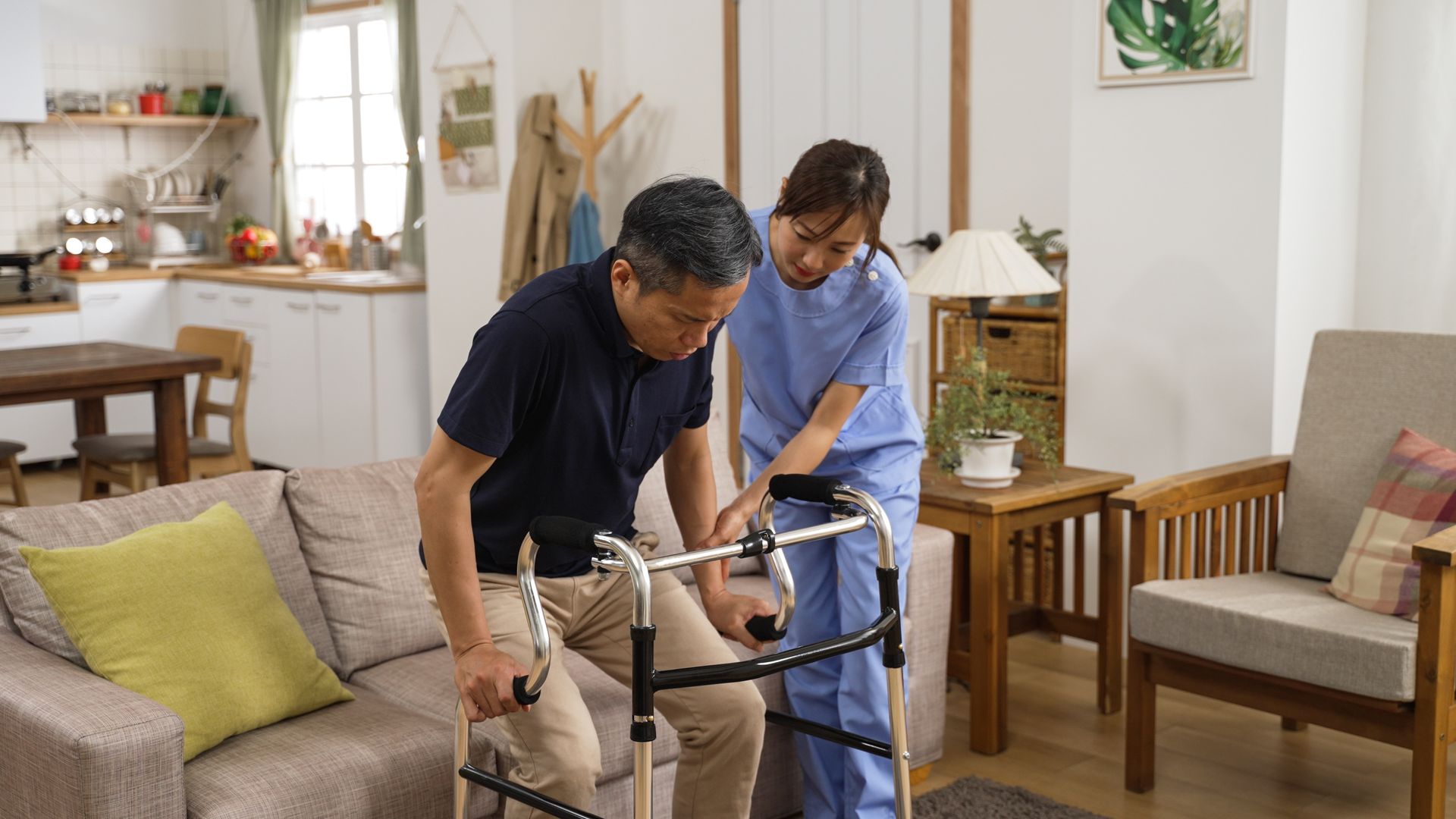 Home assistance scene with a person using a walker supported indoors in a comfortable living room. Home assistance scene with a person using a walker supported indoors in a comfortable living room.