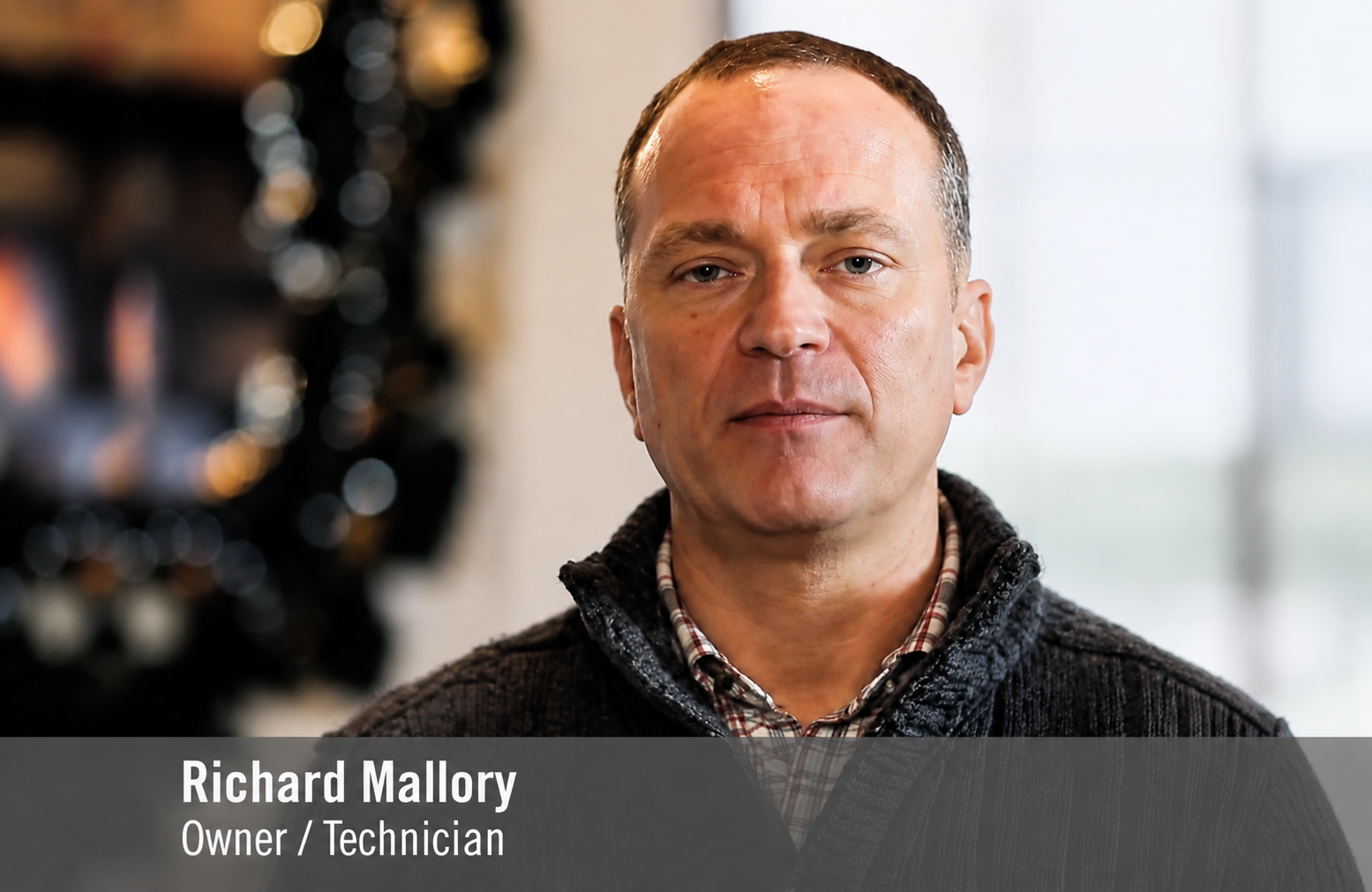 Portrait of Richard Mallory, owner/technician, with a blurred indoor background
