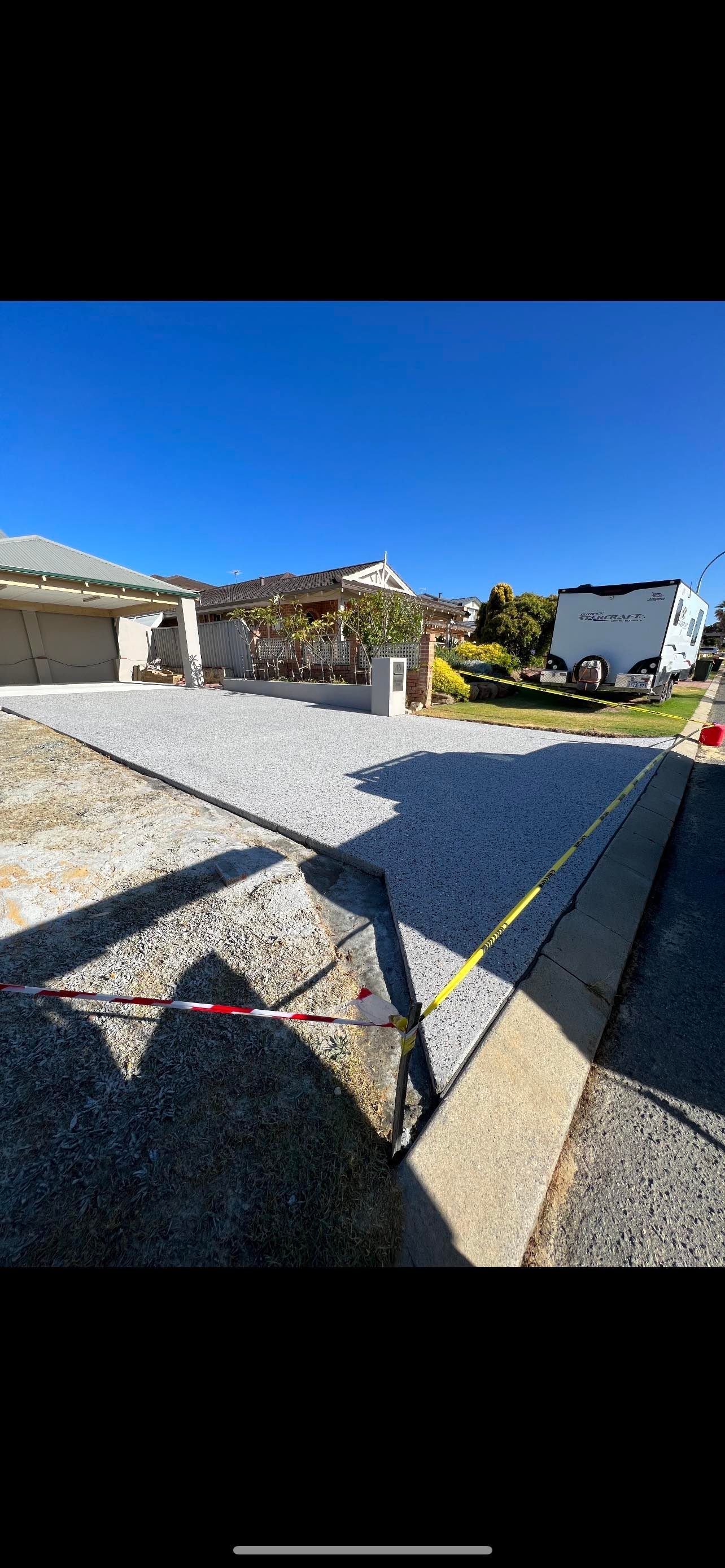 exposed aggregate concrete driveway in front of home in baldivis