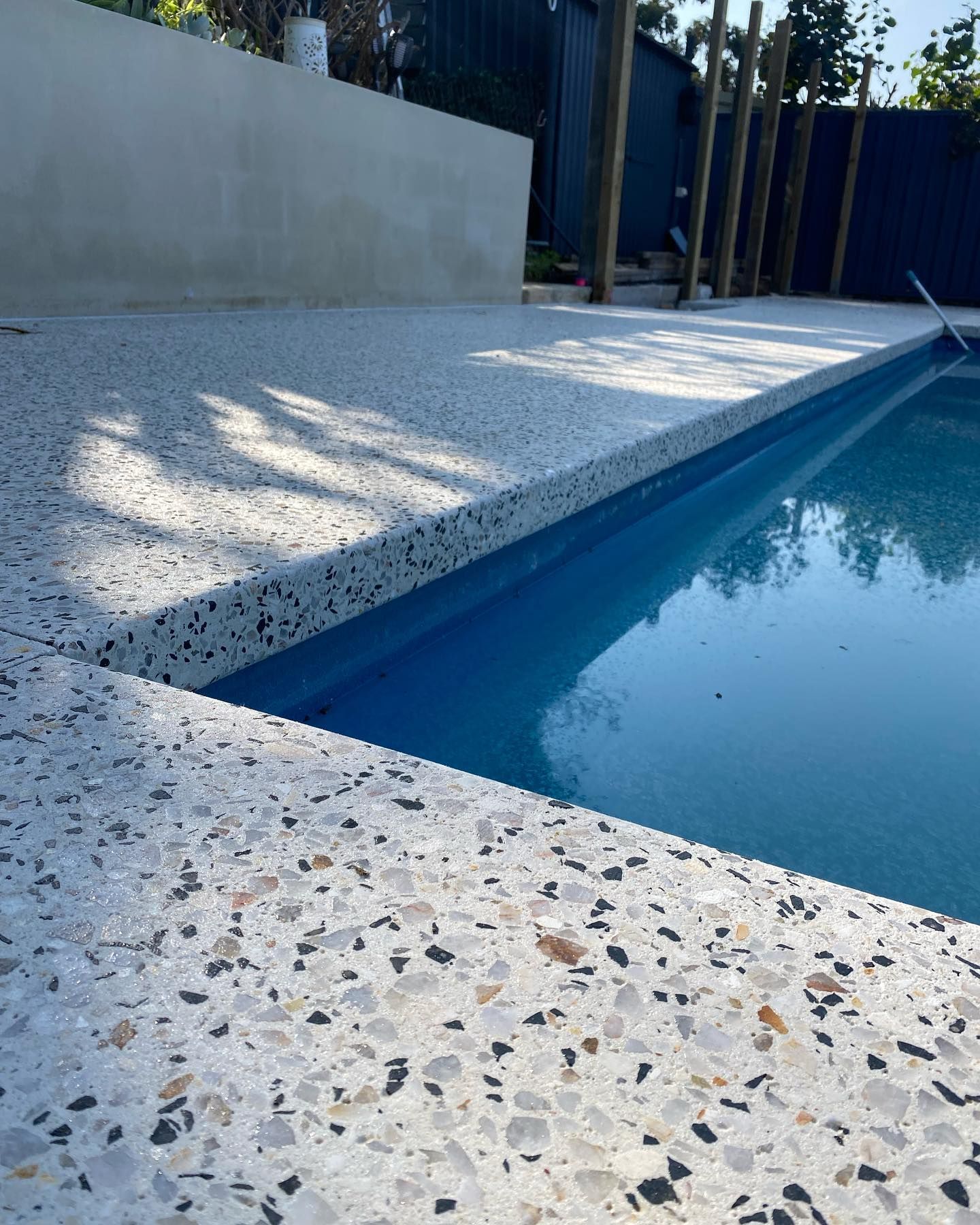 Honed concrete pool area