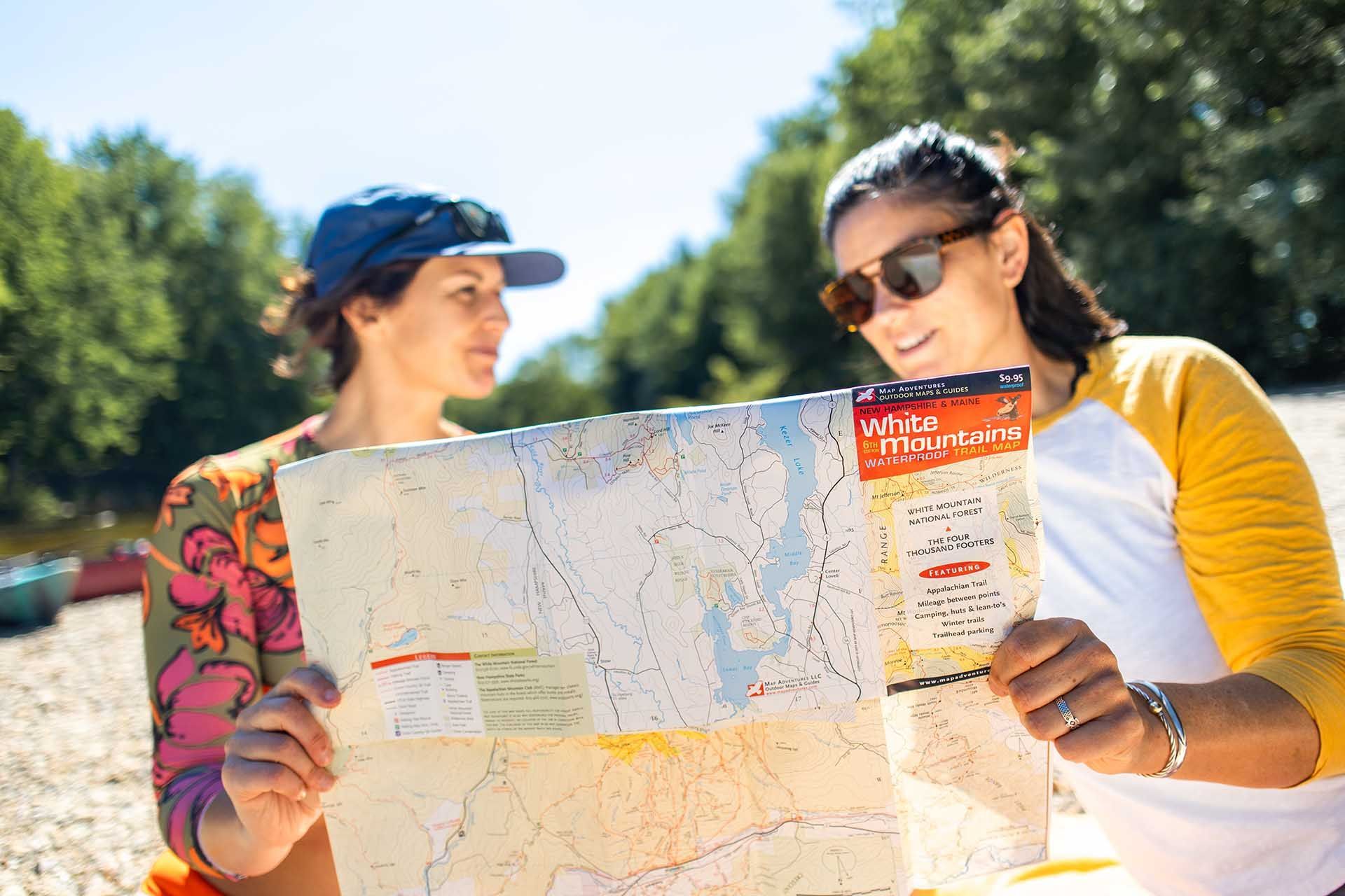 2 people looking at a map