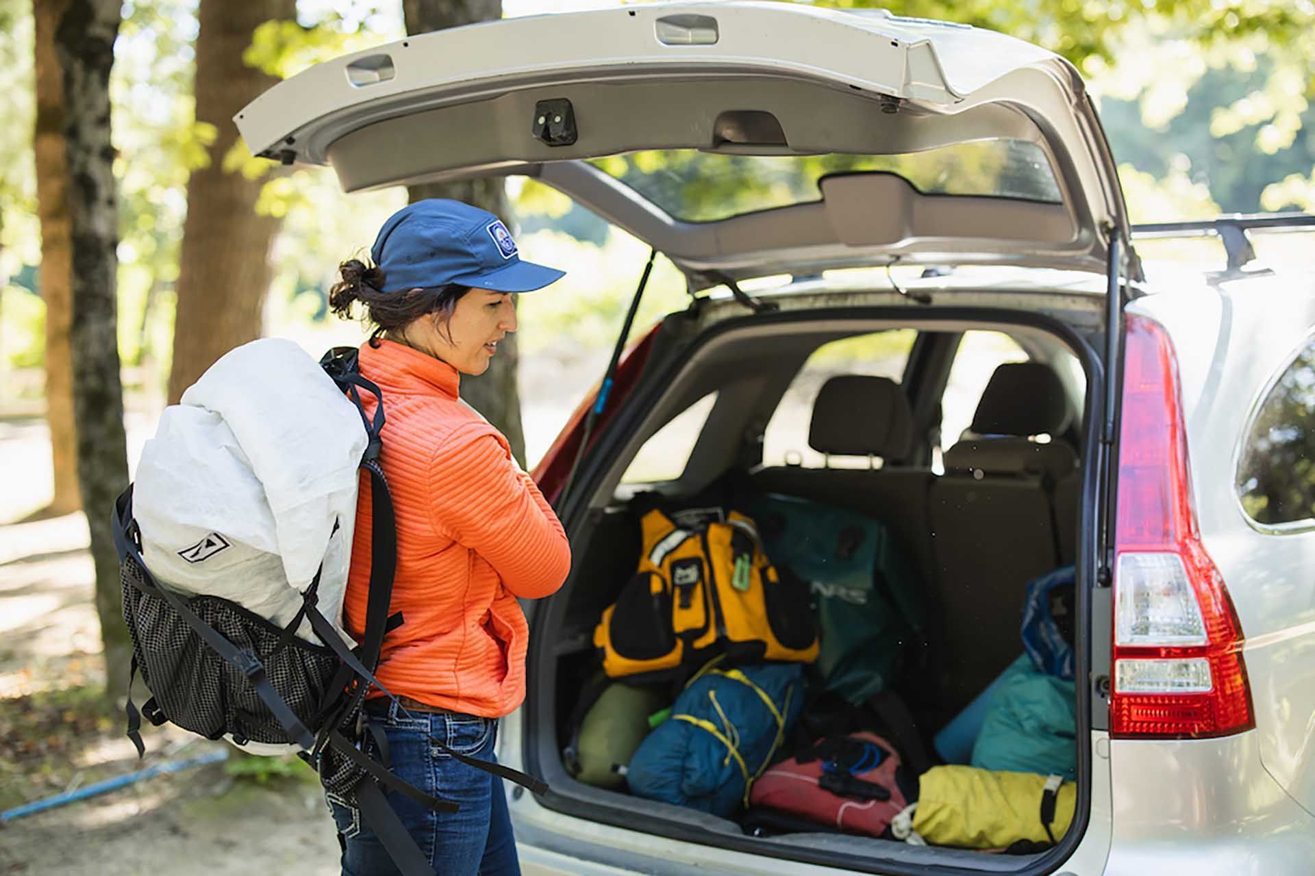 A person unpacking camping gear