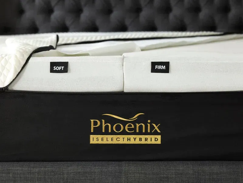 A phoenix select hybrid mattress is sitting on a bed frame