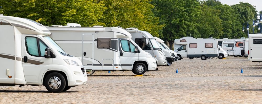 A Row of RVs Are Parked in a Parking Lot — Capital Caravans Pty Ltd In Raleigh, NSW