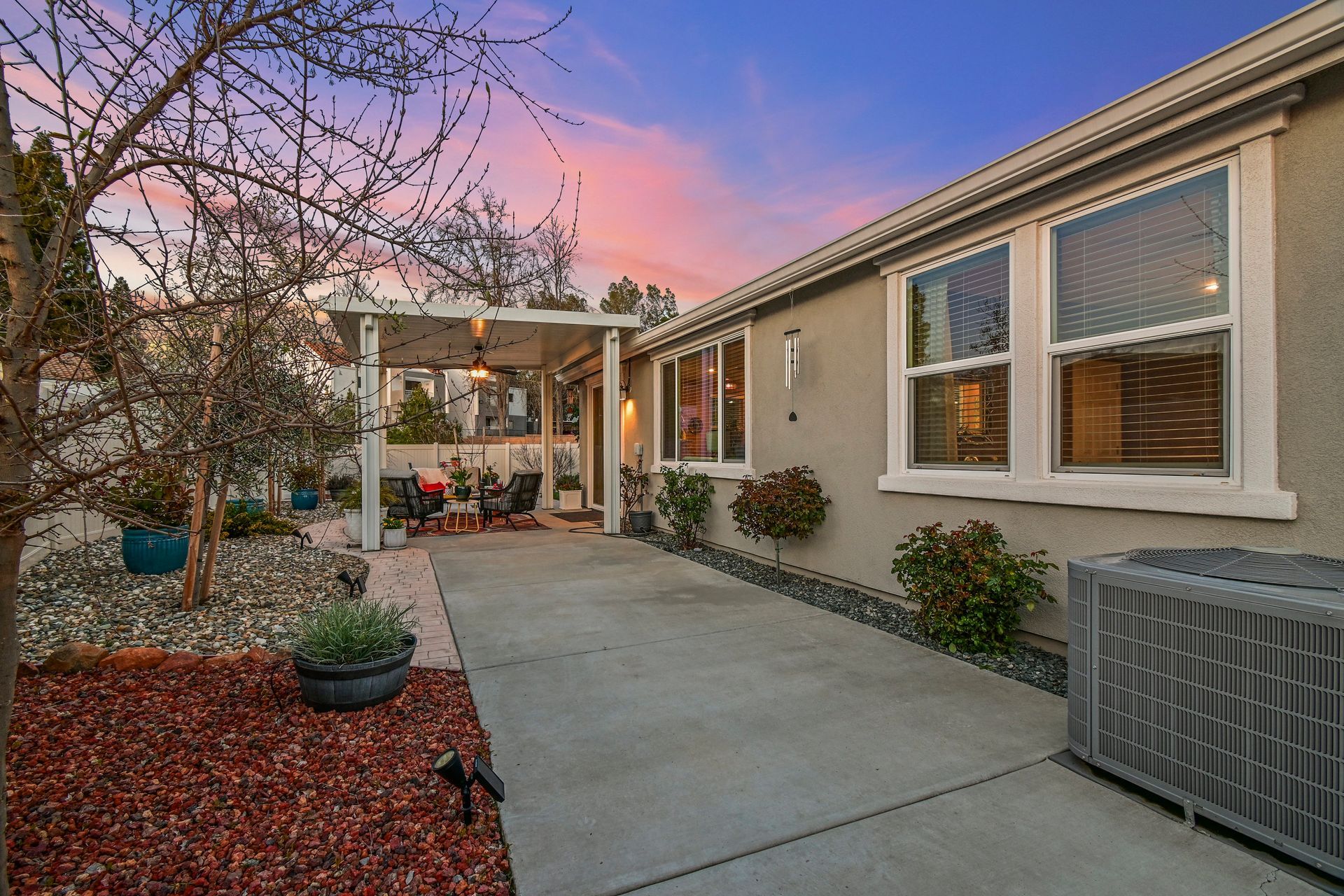 Twilight exterior with walkway and landscaped entry, represented by an experienced top realtor in Citrus Heights.