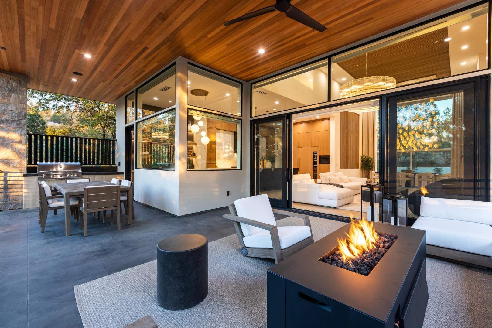 Outdoor living space with a modern fire pit, ideal for entertaining in a high-end real estate property.