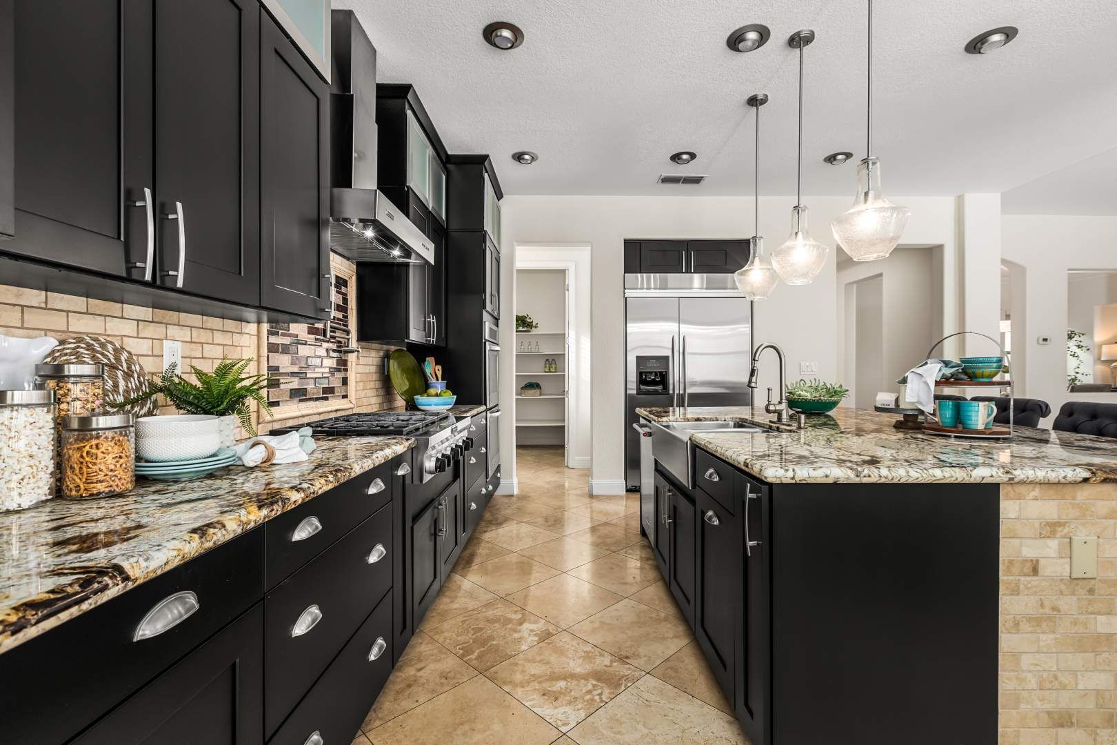 Gourmet kitchen featuring dark cabinetry and granite countertops, a top selling point for real estate.