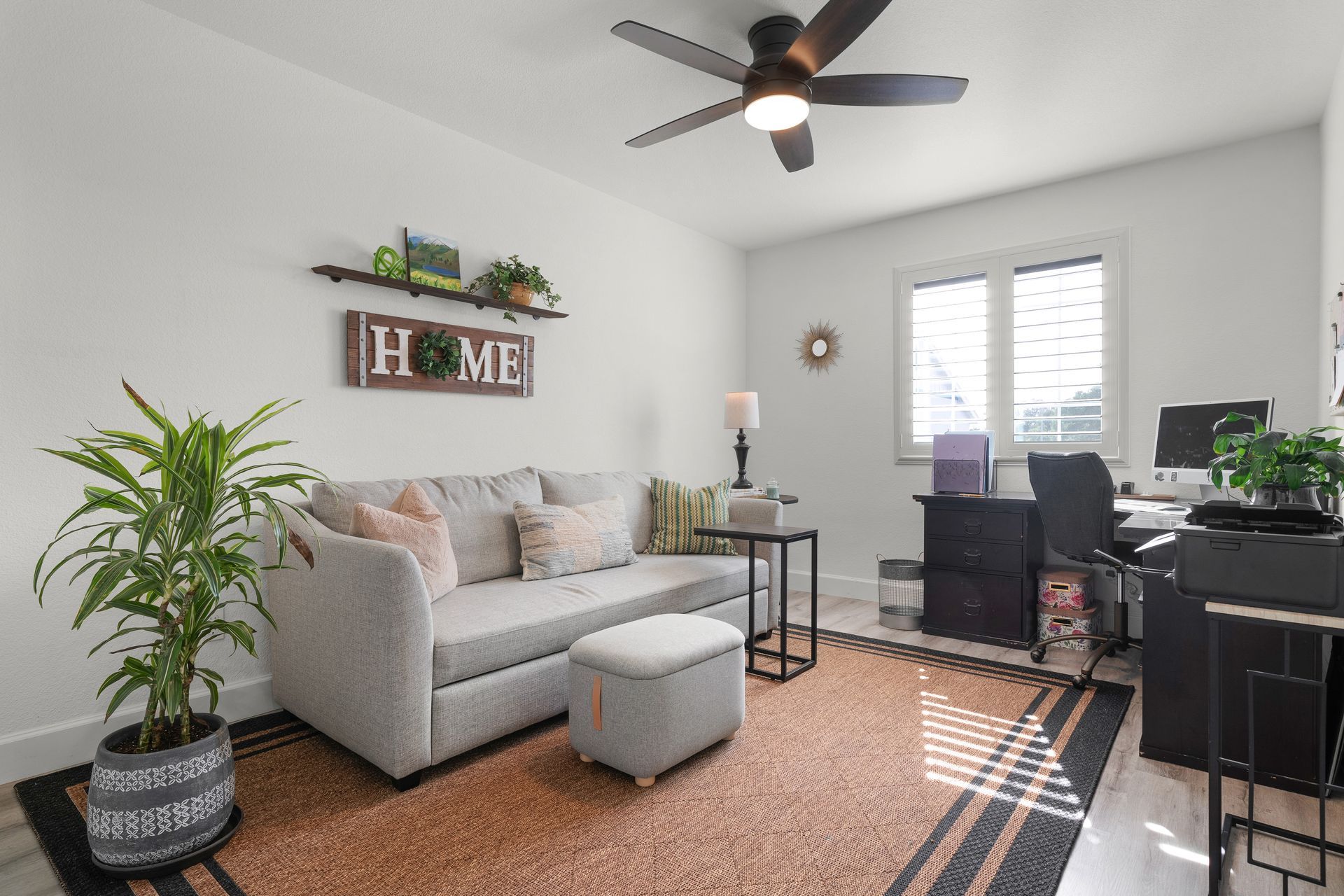 Bright living room with neutral decor and workspace, ideal for buyers searching updated Citrus Heights homes for sale.