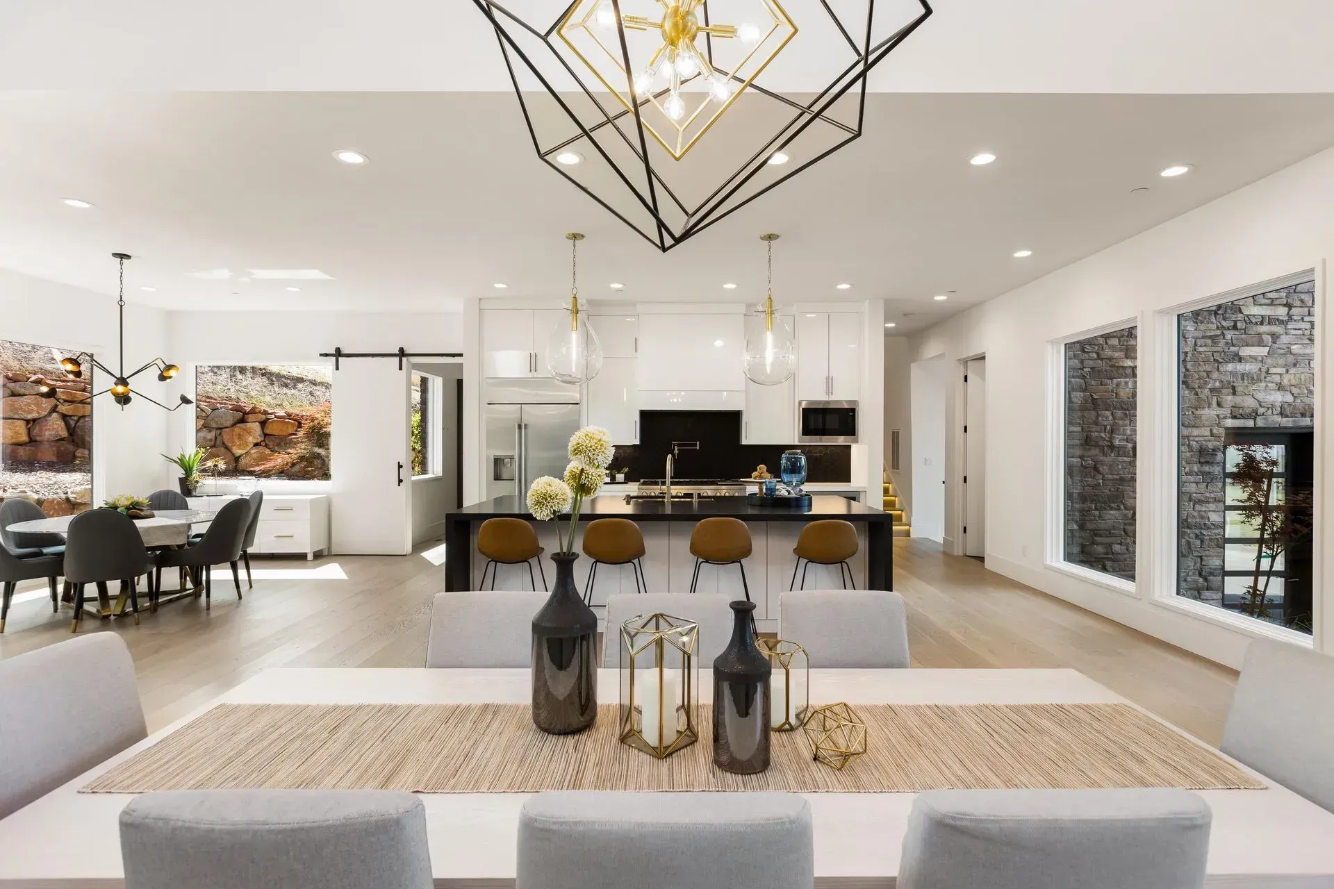 Spacious white interior with built-in shelving, center island, and natural light throughout.
