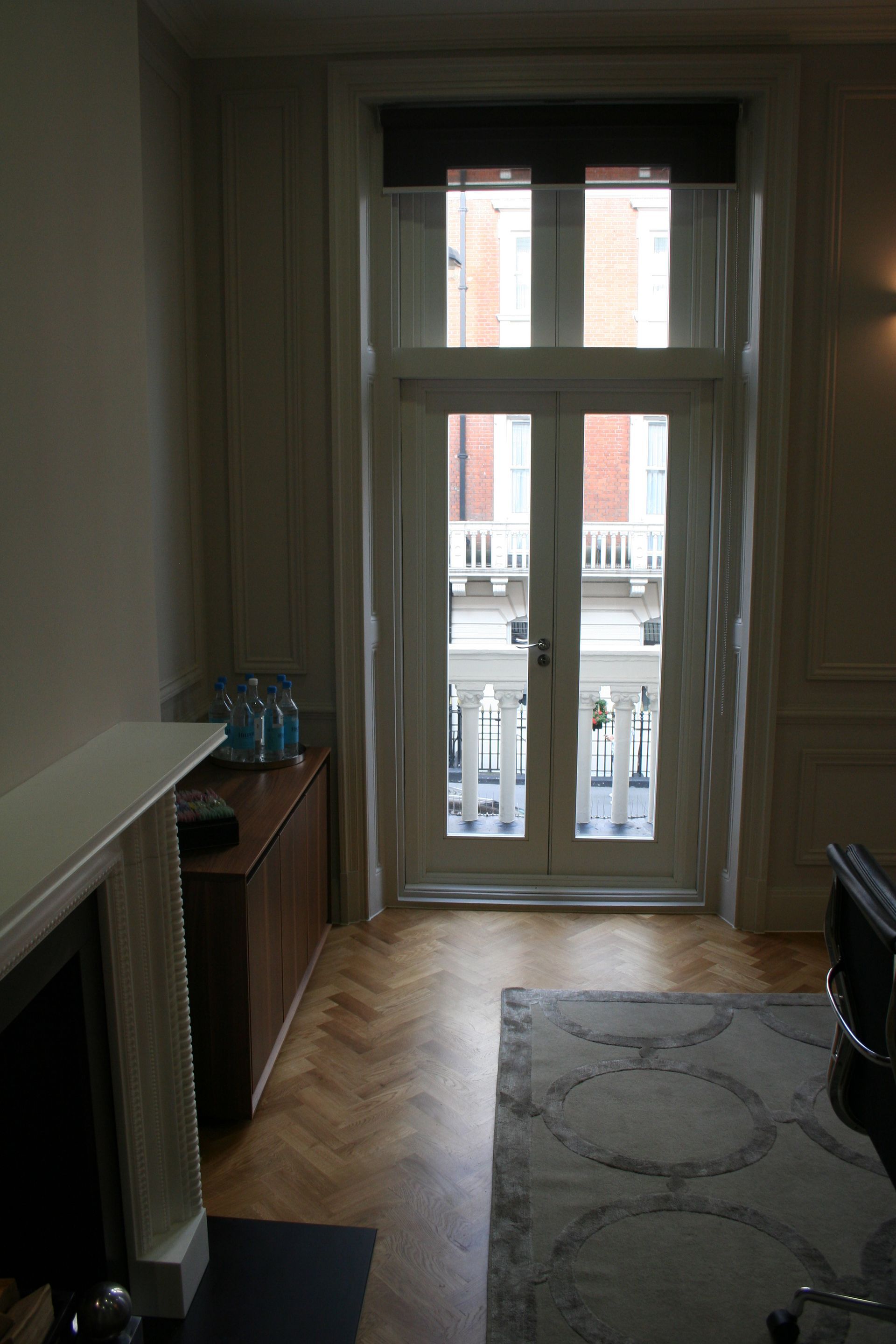 Small kitchen at Inflexion with Prime Grade Oak Parquet Flooring