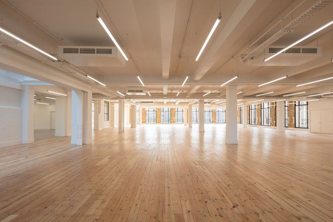 Large open room in private building with finished flooring