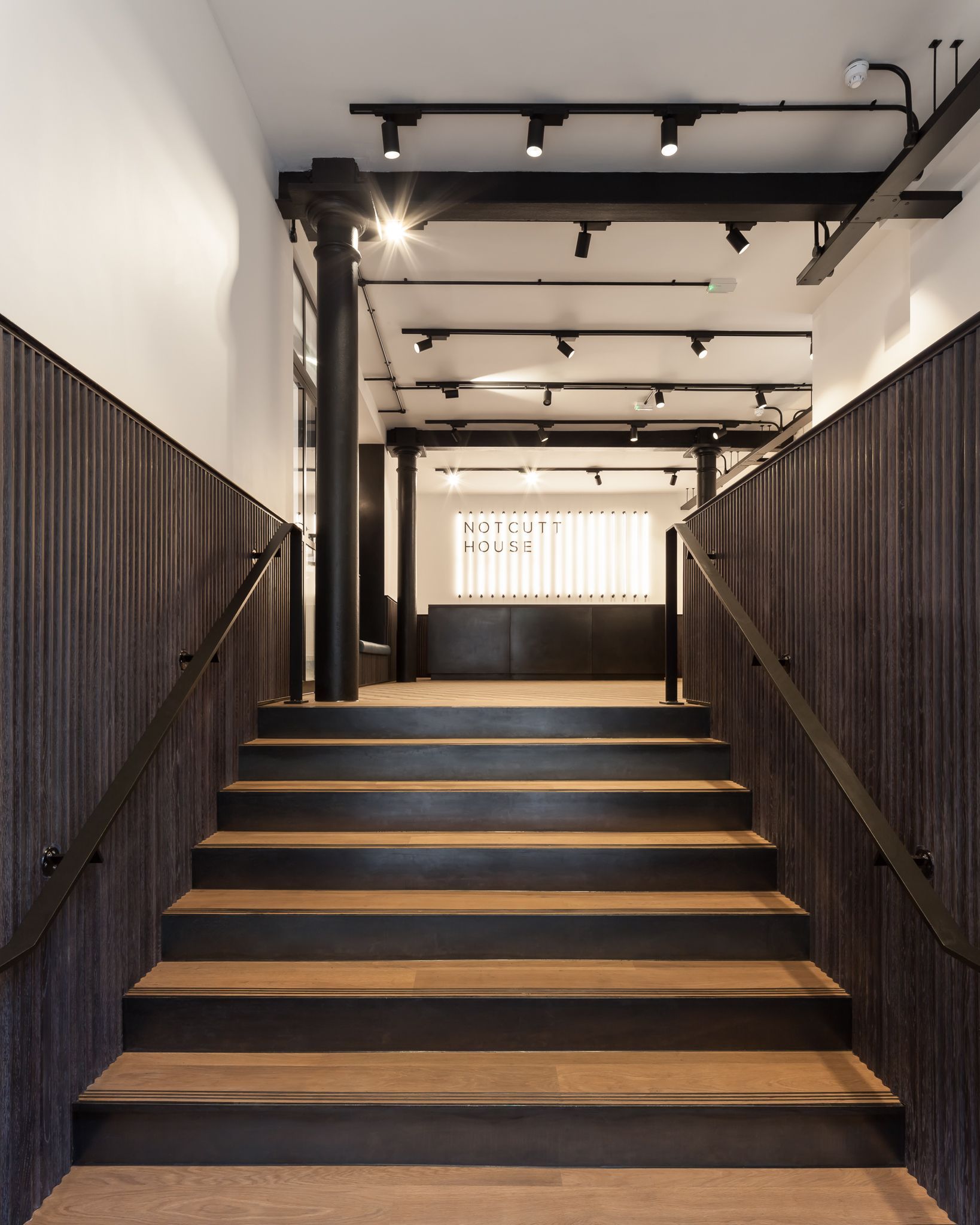 Notcutt House wooden staircase entrance with right wood chosen