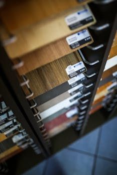 Shelves with flooring samples in various wood tones in Manchester.