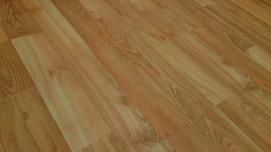 Wooden laminate flooring, light brown, with wood grain detail, angled view.