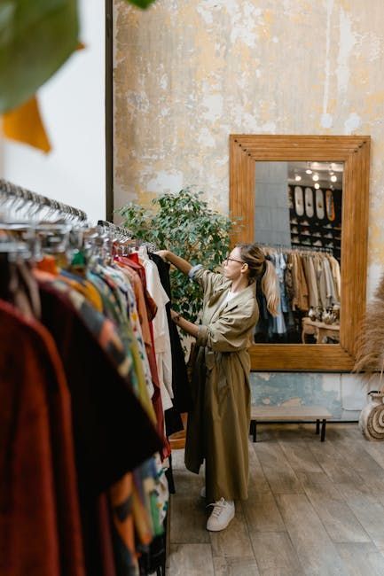 Woman browsing clothing rack in a vintage shop.