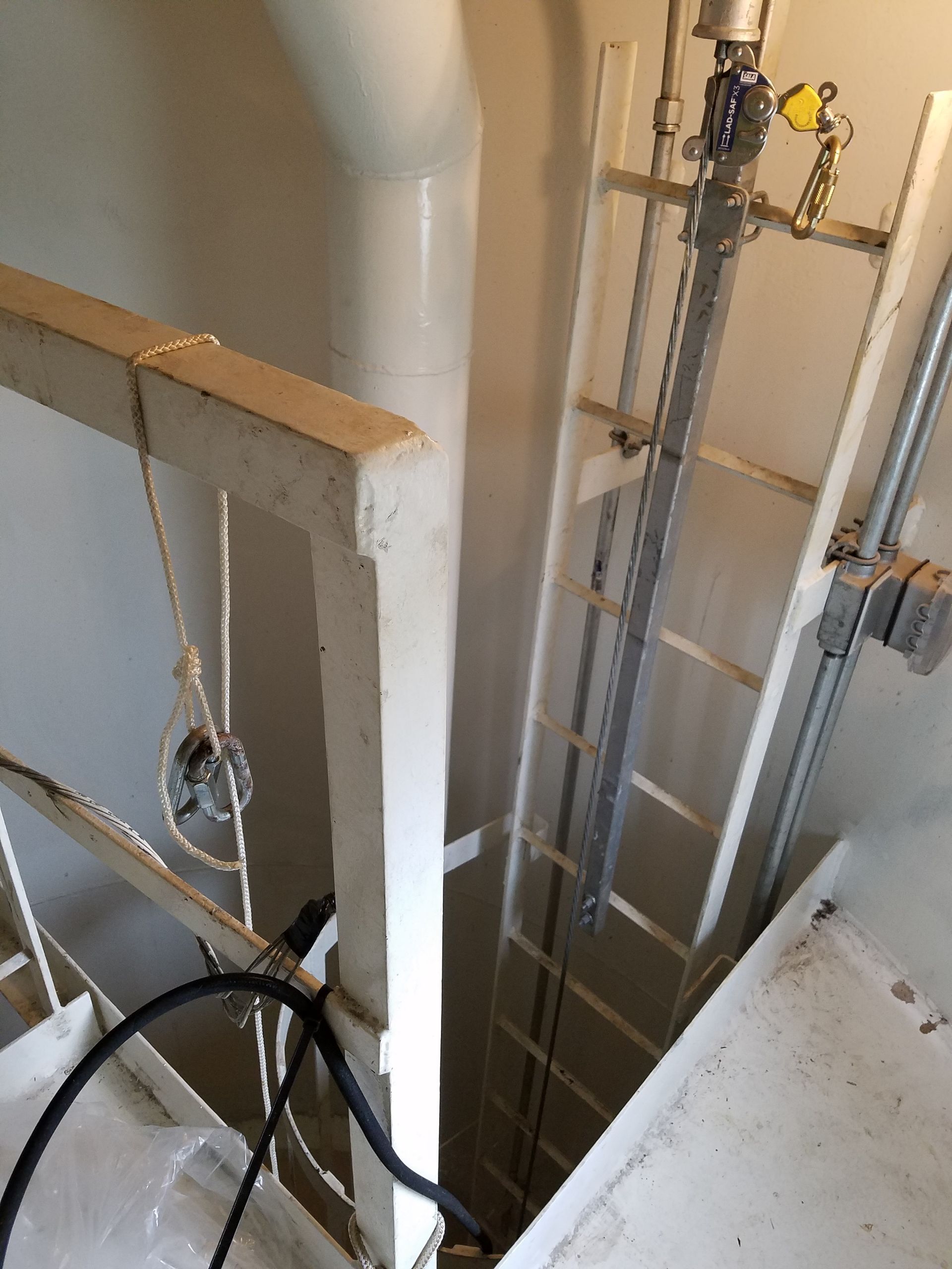 A staircase with a ladder attached to it