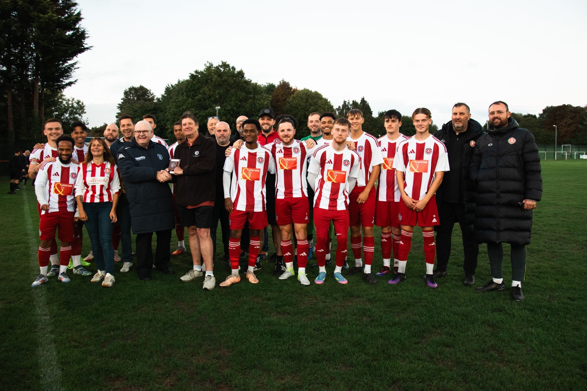 Petersfield Town's Head of Football, Mark Summerhill, receives the Division One Club of the Month for November from Wessex League official, Paul Scoble