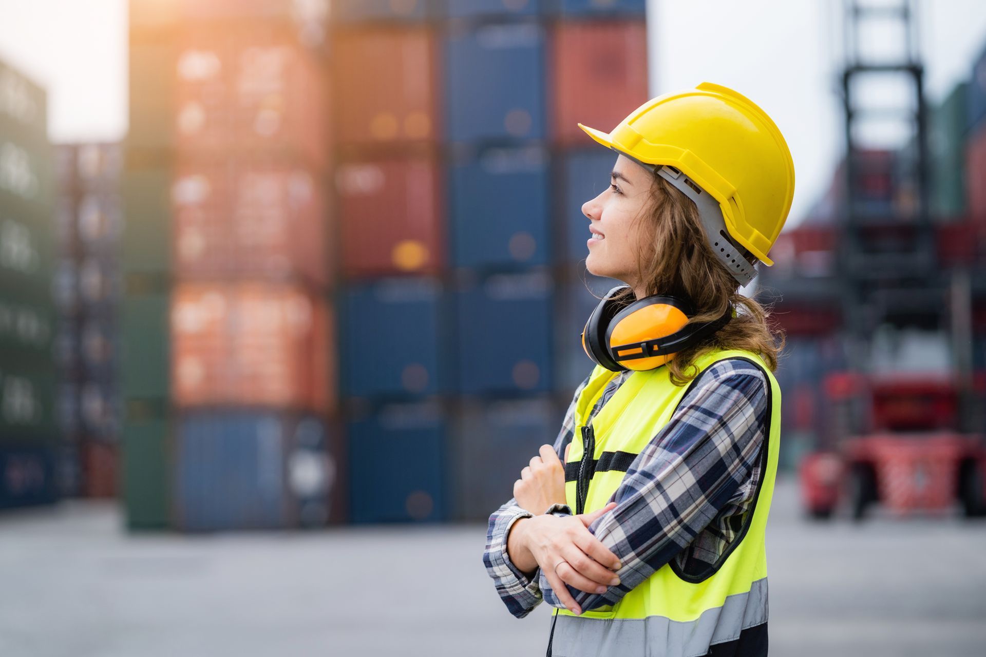 A safety vest works in a cargo logistics center.