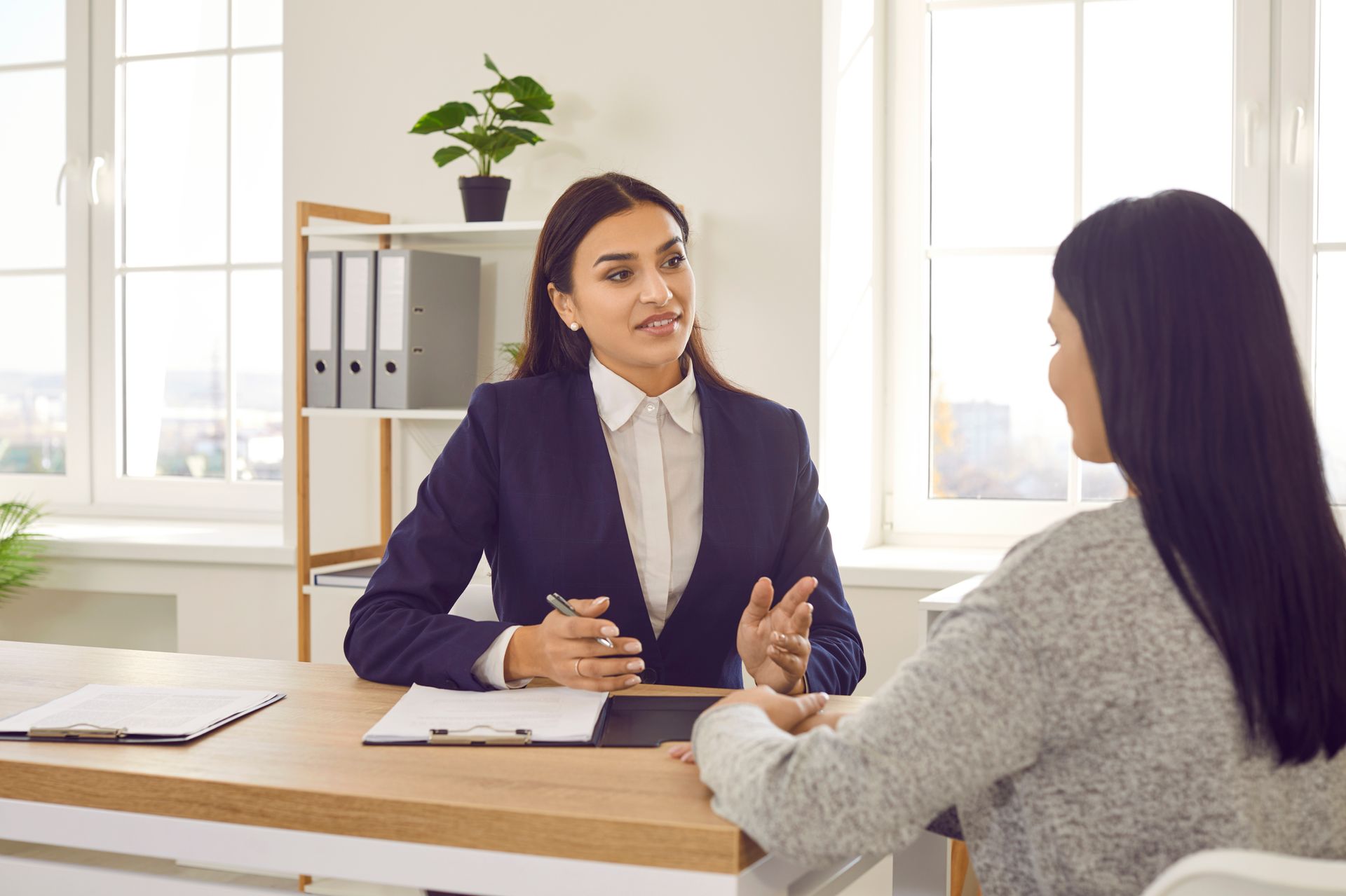 A lawyer is talking to a client. A lawyer is talking to a client.